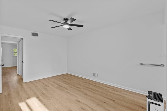 1225 58th St N Unit 204A, Saint Petersburg, FL 33710 - empty room featuring wood finished floors, ceiling fan, and baseboards