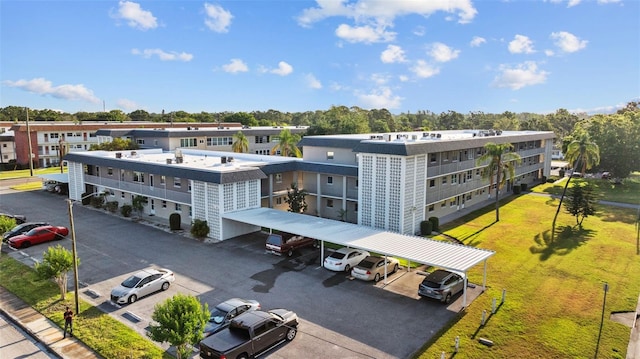1225 58th St N Unit 204A, Saint Petersburg, FL 33710 - view of apartment building / complex with covered parking