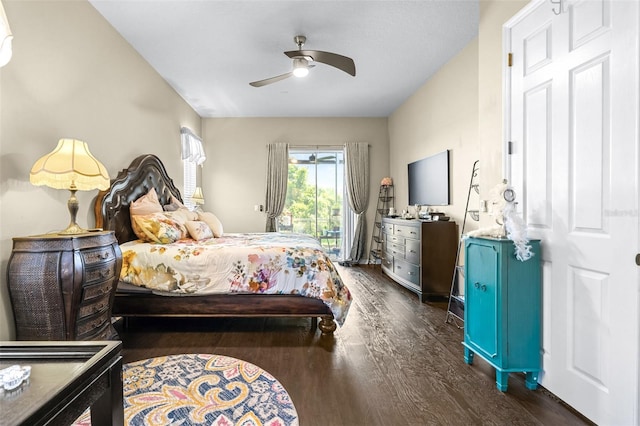 bedroom featuring dark wood-style flooring, ceiling fan, and access to exterior
