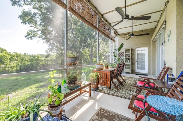 sunroom with ceiling fan and plenty of natural light
