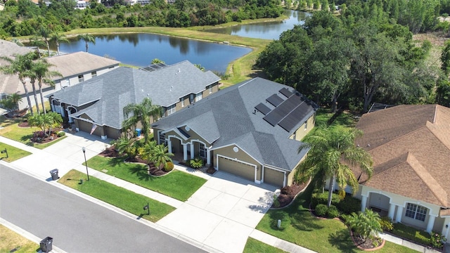 birds eye view of property with a water view