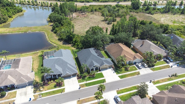 aerial view featuring a residential view and a water view