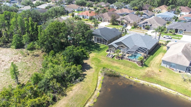 drone / aerial view featuring a residential view and a water view