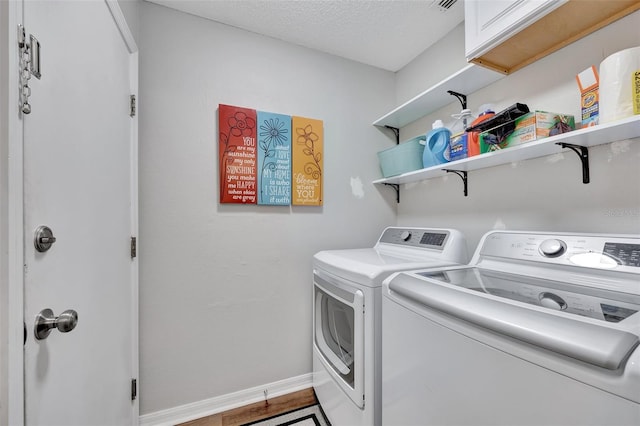 laundry area with baseboards, laundry area, and independent washer and dryer