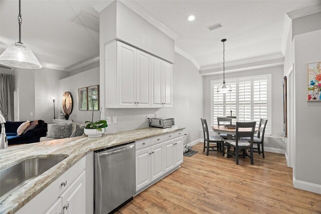 kitchen featuring stainless steel dishwasher, crown molding, visible vents, and baseboards