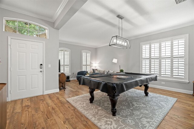 playroom with baseboards, ornamental molding, and wood finished floors