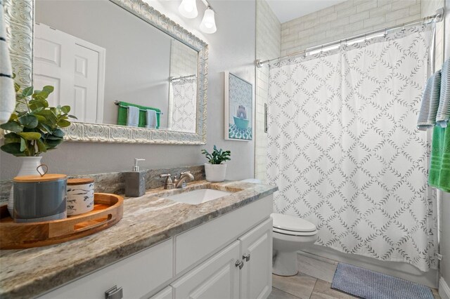 full bathroom with vanity, shower / bath combo with shower curtain, and toilet