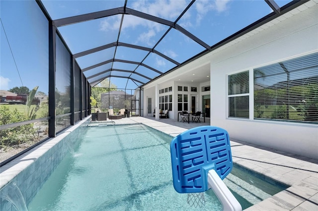 pool with a patio area and a lanai