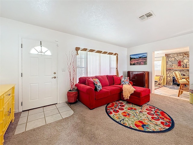 5100 Aragon Way S, Saint Petersburg, FL 33705 - living room with light colored carpet, plenty of natural light, and visible vents