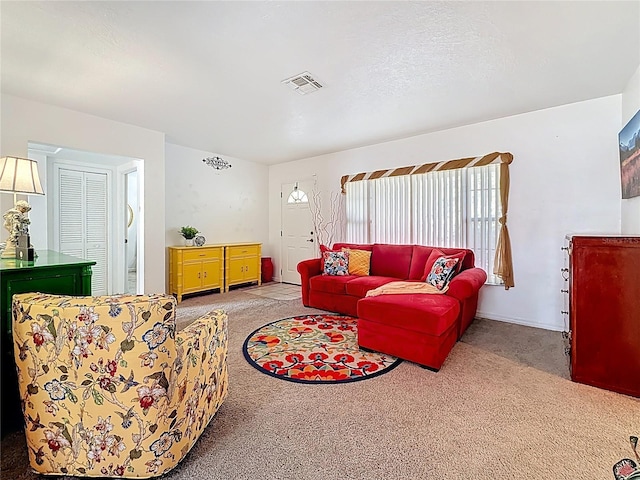 5100 Aragon Way S, Saint Petersburg, FL 33705 - living room featuring carpet flooring and visible vents