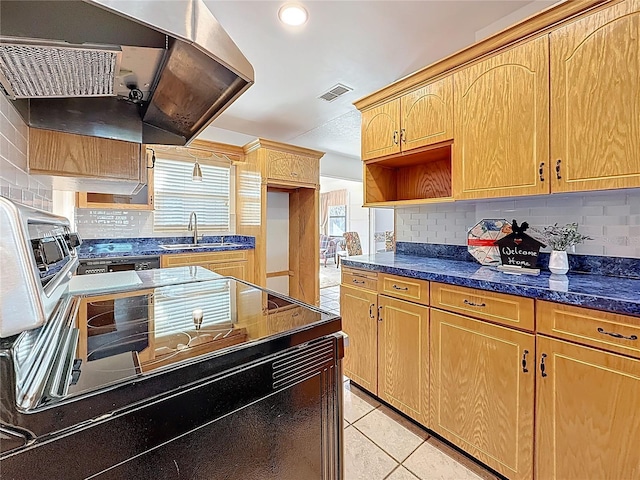 5100 Aragon Way S, Saint Petersburg, FL 33705 - kitchen with a sink, open shelves, visible vents, decorative backsplash, and light tile patterned flooring