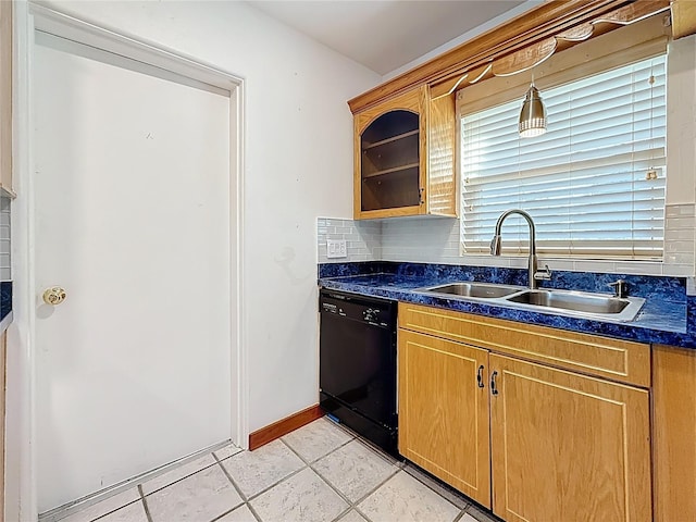5100 Aragon Way S, Saint Petersburg, FL 33705 - kitchen featuring glass insert cabinets, a sink, dark countertops, black dishwasher, and backsplash