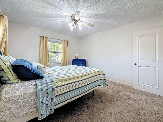 5100 Aragon Way S, Saint Petersburg, FL 33705 - bedroom featuring carpet flooring, a textured ceiling, baseboards, and a ceiling fan