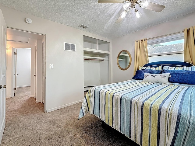 5100 Aragon Way S, Saint Petersburg, FL 33705 - carpeted bedroom with a textured ceiling, visible vents, and a ceiling fan