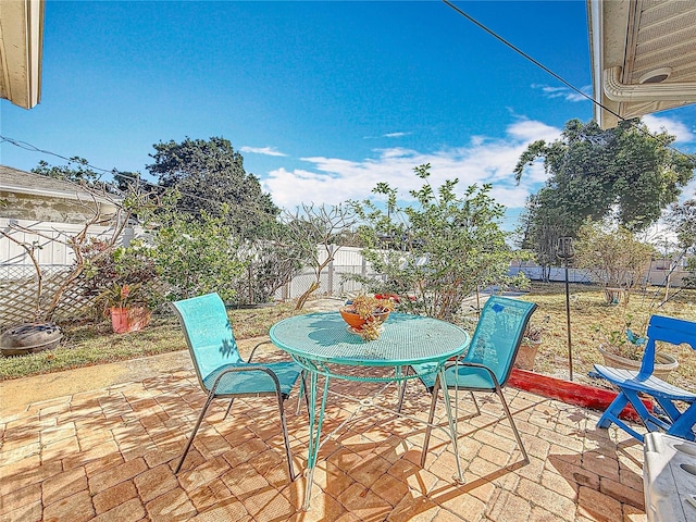 5100 Aragon Way S, Saint Petersburg, FL 33705 - view of patio / terrace featuring outdoor dining space and a fenced backyard