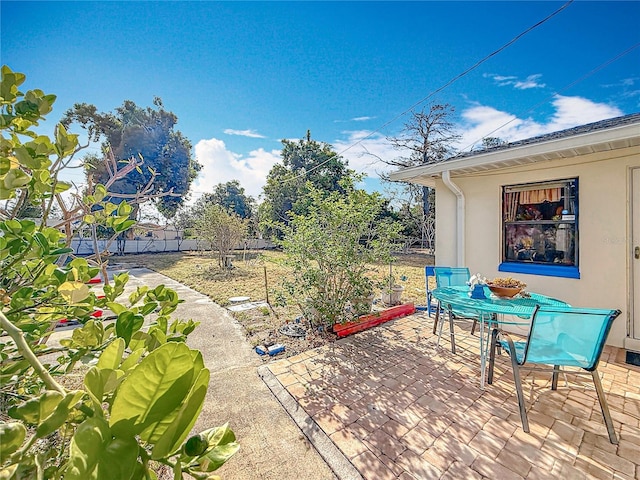 5100 Aragon Way S, Saint Petersburg, FL 33705 - view of patio / terrace with outdoor dining area and fence