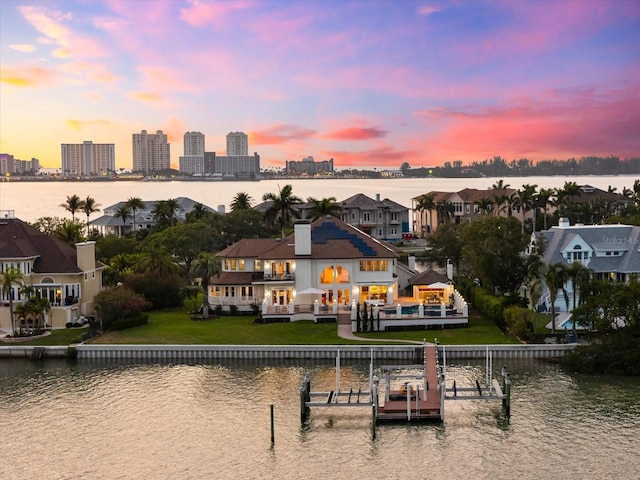 429 St Andrews Dr, Belleair, FL 33756 - rear view of property with a water view, a yard, and a balcony