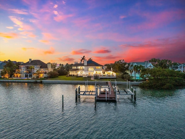429 St Andrews Dr, Belleair, FL 33756 - dock featuring boat lift and a water view