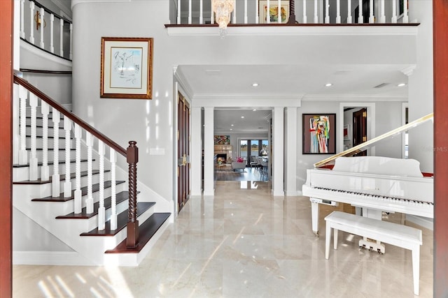 429 St Andrews Dr, Belleair, FL 33756 - foyer with crown molding, stairs, baseboards, recessed lighting, and marble tiled flooring