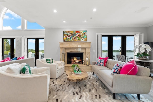 429 St Andrews Dr, Belleair, FL 33756 - living area featuring french doors, plenty of natural light, recessed lighting, ornamental molding, and a high end fireplace
