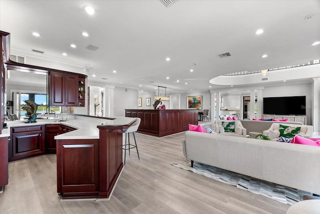 429 St Andrews Dr, Belleair, FL 33756 - living room featuring recessed lighting, light wood finished floors, and ornamental molding