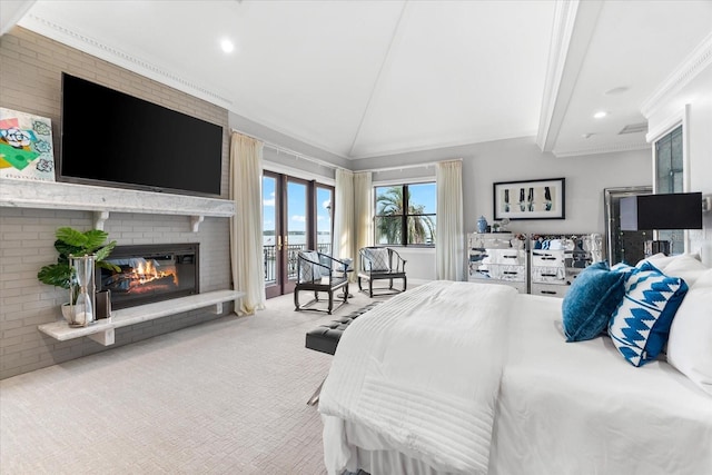 429 St Andrews Dr, Belleair, FL 33756 - bedroom with vaulted ceiling, carpet floors, access to exterior, a fireplace, and ornamental molding