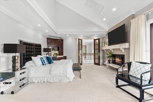 429 St Andrews Dr, Belleair, FL 33756 - bedroom with lofted ceiling, recessed lighting, light carpet, a fireplace, and crown molding