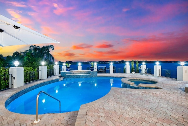 429 St Andrews Dr, Belleair, FL 33756 - view of swimming pool with a pool with connected hot tub and a patio