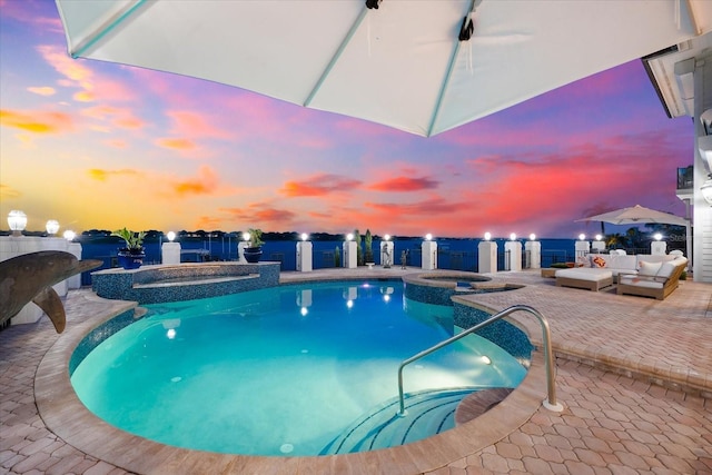 429 St Andrews Dr, Belleair, FL 33756 - view of swimming pool with a pool with connected hot tub, a patio, and outdoor lounge area