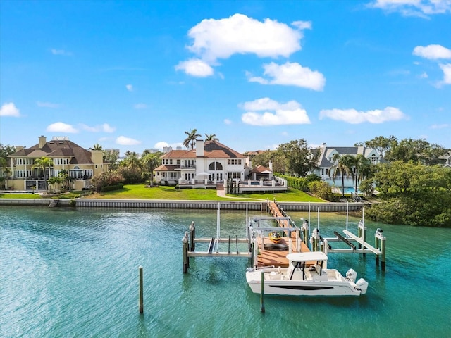 429 St Andrews Dr, Belleair, FL 33756 - dock with boat lift, a water view, a residential view, and a lawn