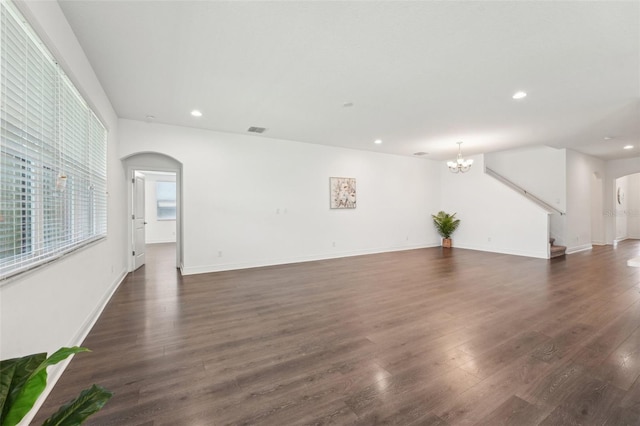 1741 Cherry Walk Rd, Lutz, FL 33558 - unfurnished living room featuring visible vents, recessed lighting, a notable chandelier, and arched walkways