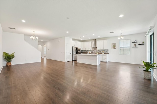 1741 Cherry Walk Rd, Lutz, FL 33558 - unfurnished living room with dark wood-style floors, recessed lighting, visible vents, and a chandelier