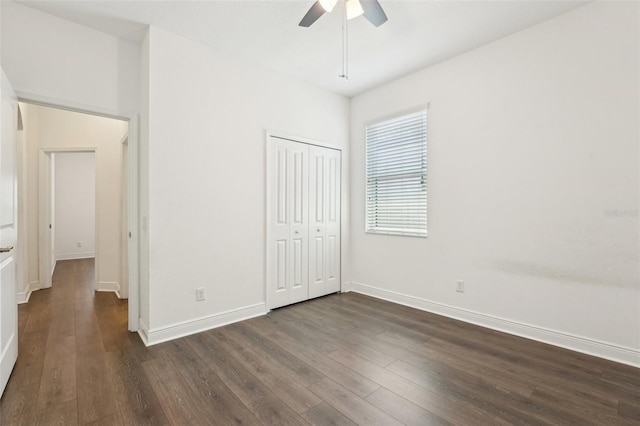 1741 Cherry Walk Rd, Lutz, FL 33558 - unfurnished bedroom featuring dark wood-style flooring, a closet, a ceiling fan, and baseboards