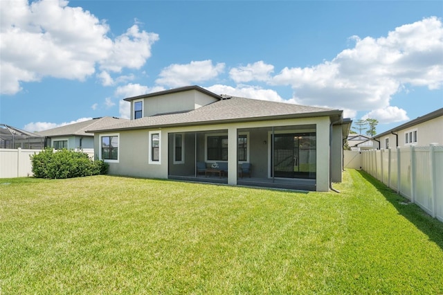 1741 Cherry Walk Rd, Lutz, FL 33558 - back of house with a sunroom, a yard, stucco siding, and a fenced backyard