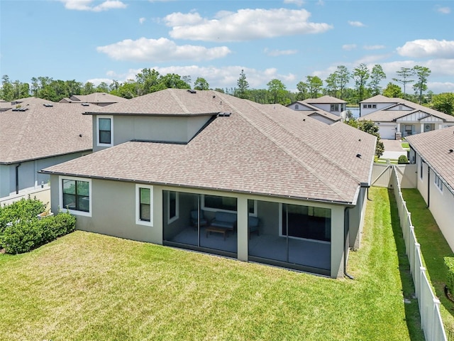 1741 Cherry Walk Rd, Lutz, FL 33558 - back of house featuring a fenced backyard, a shingled roof, a sunroom, and a lawn