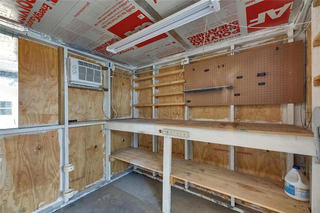 storage room featuring a wall mounted air conditioner