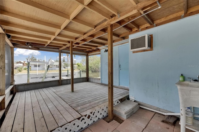 deck with an AC wall unit and a residential view