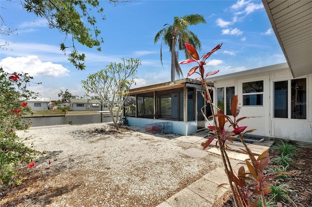 exterior space featuring a sunroom