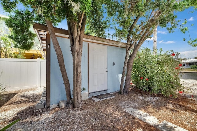 view of shed with fence