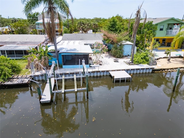 view of dock featuring a water view and boat lift