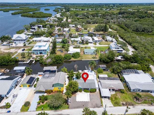 birds eye view of property with a water view and a residential view