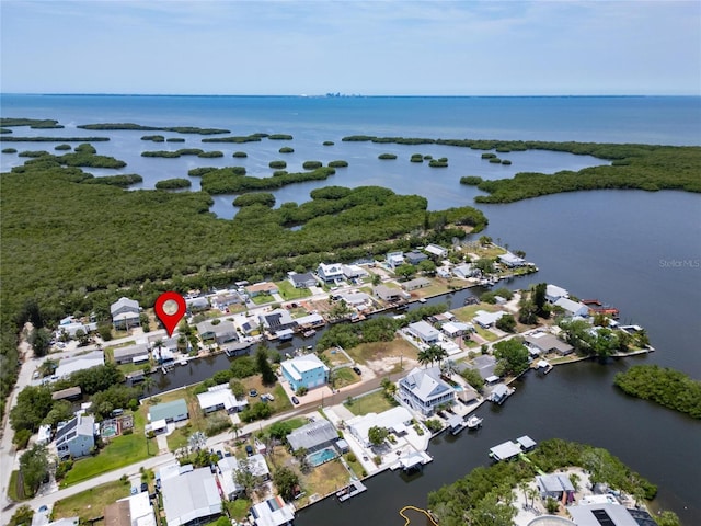 birds eye view of property with a residential view and a water view