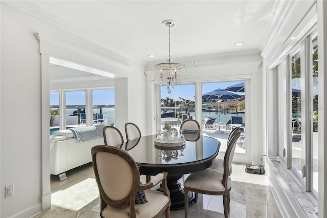 2233 Donato Dr, Belleair Beach, FL 33786 - dining room featuring recessed lighting, a water view, ornamental molding, and a notable chandelier