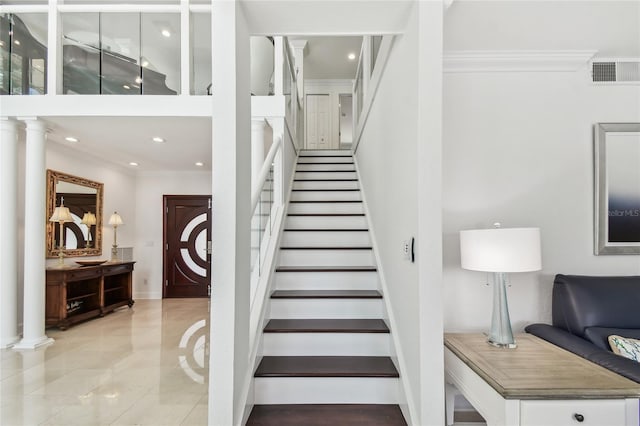 2233 Donato Dr, Belleair Beach, FL 33786 - stairs featuring recessed lighting, baseboards, visible vents, decorative columns, and crown molding