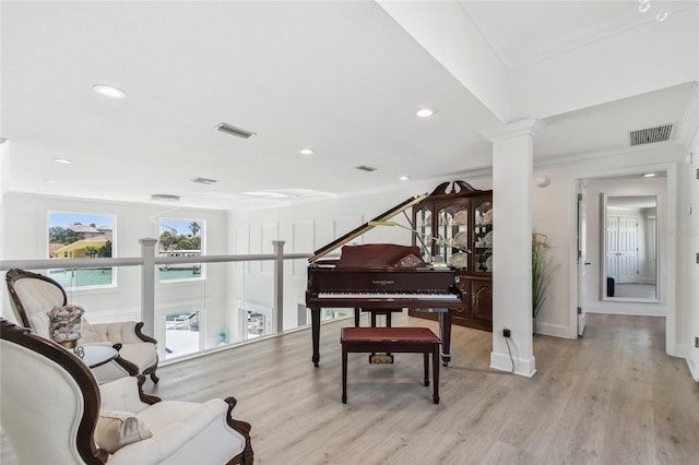 2233 Donato Dr, Belleair Beach, FL 33786 - living area featuring crown molding, light wood finished floors, visible vents, and recessed lighting