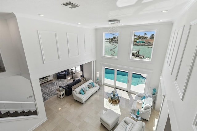 2233 Donato Dr, Belleair Beach, FL 33786 - living area with light tile patterned floors, recessed lighting, a water view, and visible vents