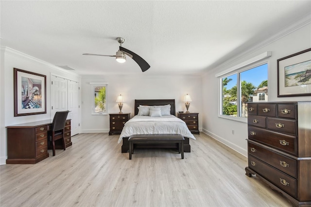 2233 Donato Dr, Belleair Beach, FL 33786 - bedroom with baseboards, multiple windows, and light wood-style flooring