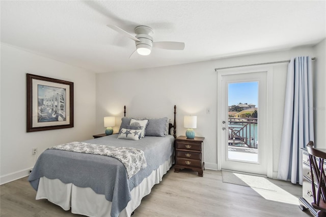 2233 Donato Dr, Belleair Beach, FL 33786 - bedroom featuring light wood finished floors, baseboards, access to exterior, and ceiling fan
