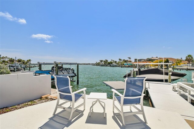 2233 Donato Dr, Belleair Beach, FL 33786 - dock area featuring a water view and boat lift