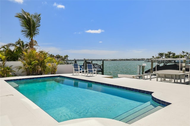 2233 Donato Dr, Belleair Beach, FL 33786 - outdoor pool featuring fence, boat lift, a patio area, a boat dock, and a water view